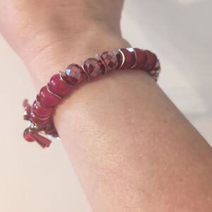 673 Red Glass Beaded and Silver Spacers Stretch Bracelet with Red Tassel
